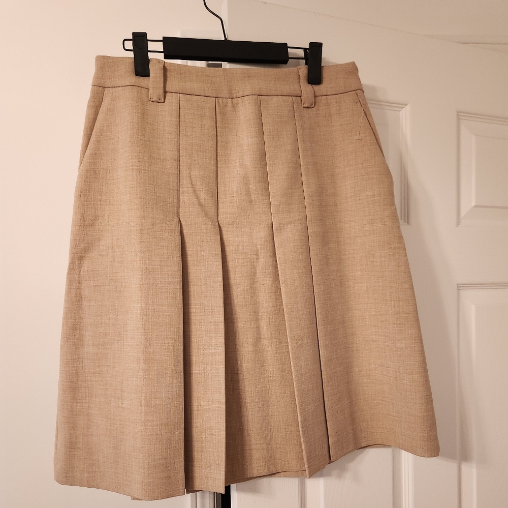 Wilfred pleated beige skirt new without tags. Hits below knee length Size 10.